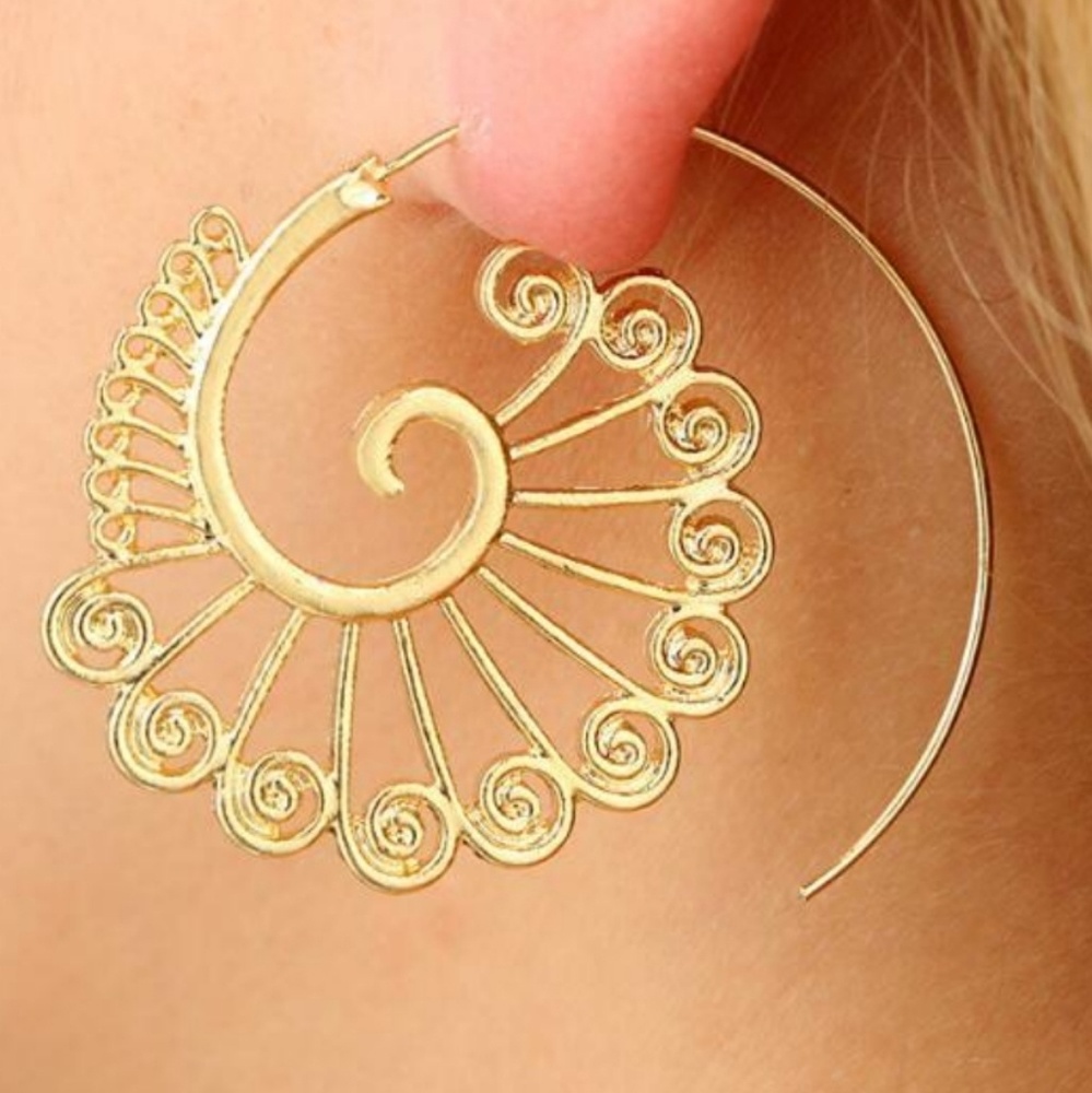 Indian tribal symbols. Round spiritual earrings.